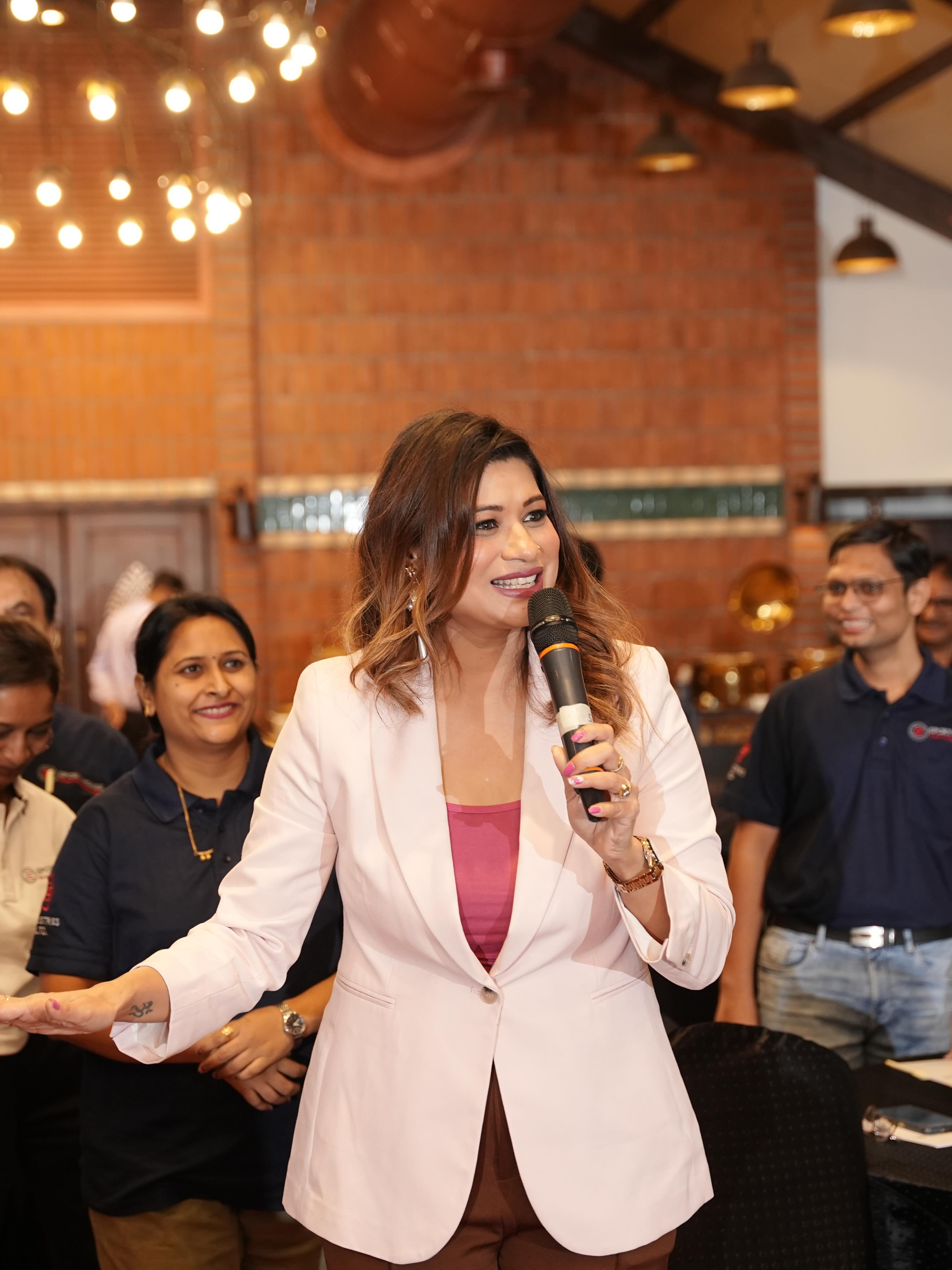 Monica hosting a corporate meet